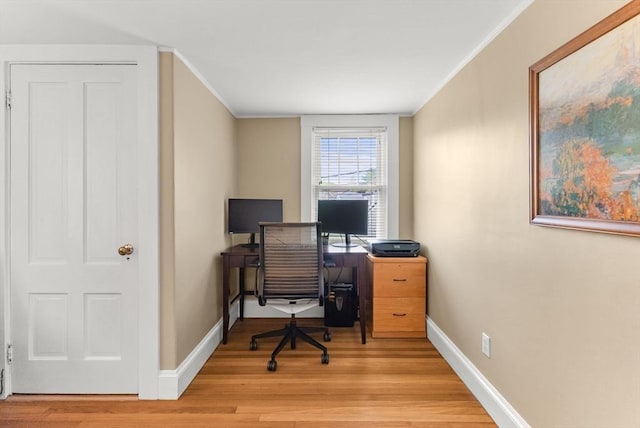 571 Washington St, Winchester, MA 01890 - home office with crown molding, light wood-type flooring, and baseboards