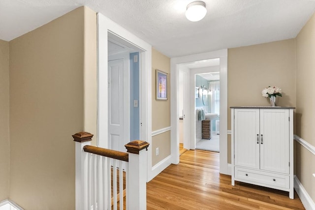 571 Washington St, Winchester, MA 01890 - hallway with light wood-type flooring and baseboards