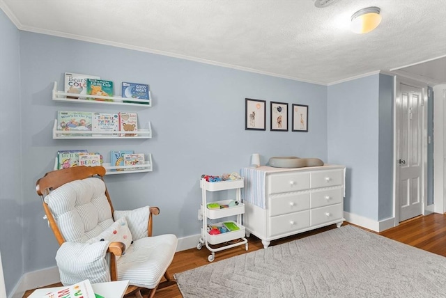 571 Washington St, Winchester, MA 01890 - sitting room with wood finished floors, ornamental molding, and baseboards