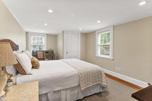 571 Washington St, Winchester, MA 01890 - bedroom featuring wood finished floors, baseboards, recessed lighting, crown molding, and multiple windows