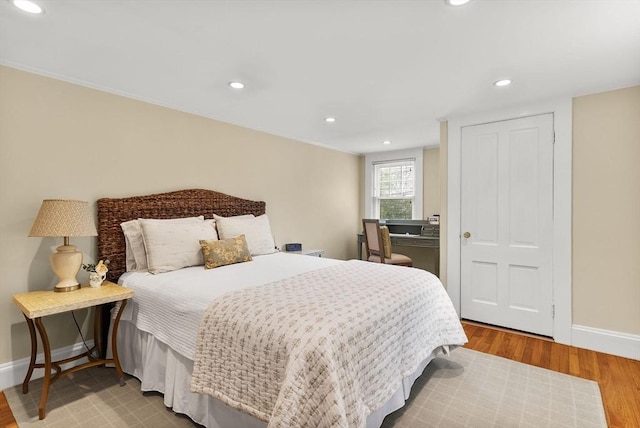 571 Washington St, Winchester, MA 01890 - bedroom with baseboards, wood finished floors, and recessed lighting