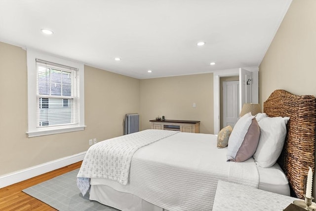571 Washington St, Winchester, MA 01890 - bedroom featuring radiator, wood finished floors, baseboards, and recessed lighting