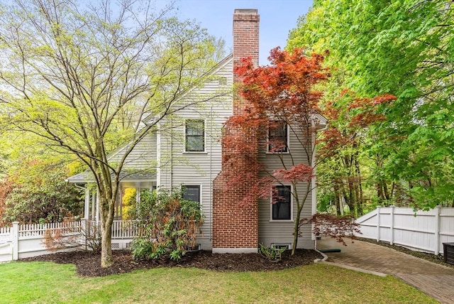 571 Washington St, Winchester, MA 01890 - view of side of property with a chimney