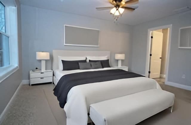 bedroom with carpet floors, baseboards, and ceiling fan