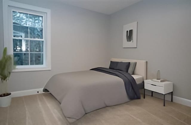 bedroom with baseboards and carpet flooring