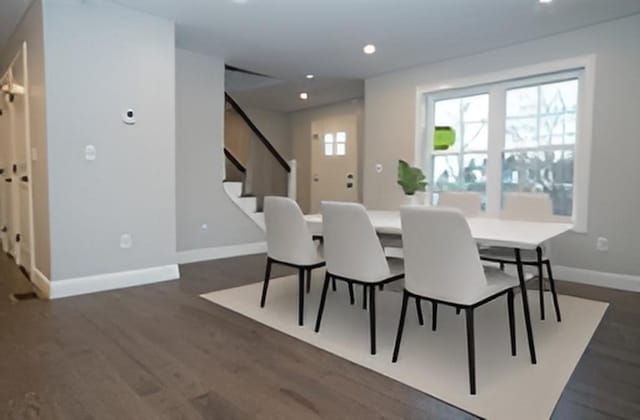 dining area with recessed lighting, baseboards, stairway, and dark wood finished floors