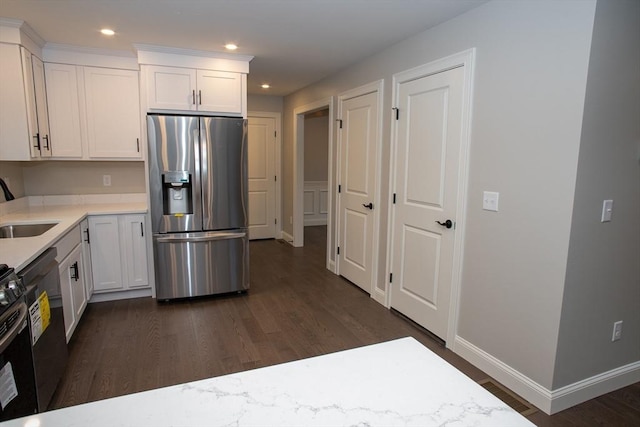 kitchen featuring stainless steel fridge with ice dispenser, dark wood-style flooring, light countertops, and white cabinets