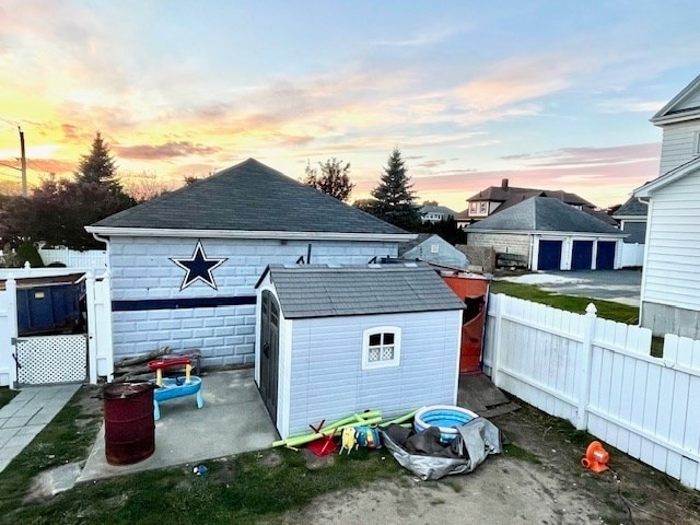 view of outdoor structure at dusk