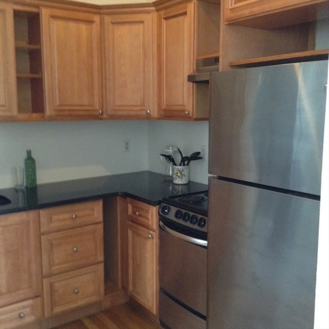 kitchen with hardwood / wood-style floors and stainless steel appliances