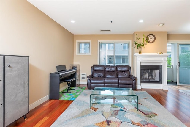 200 Falls Blvd Unit F305, Quincy, MA 02169 - living room featuring wood finished floors, baseboards, a glass covered fireplace, and recessed lighting