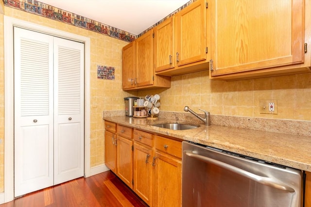 200 Falls Blvd Unit F305, Quincy, MA 02169 - kitchen with stainless steel dishwasher, a sink, light stone countertops, dark wood-style flooring, and tasteful backsplash