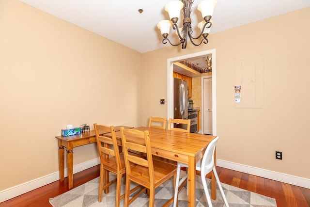 200 Falls Blvd Unit F305, Quincy, MA 02169 - dining area featuring a chandelier, baseboards, and wood finished floors