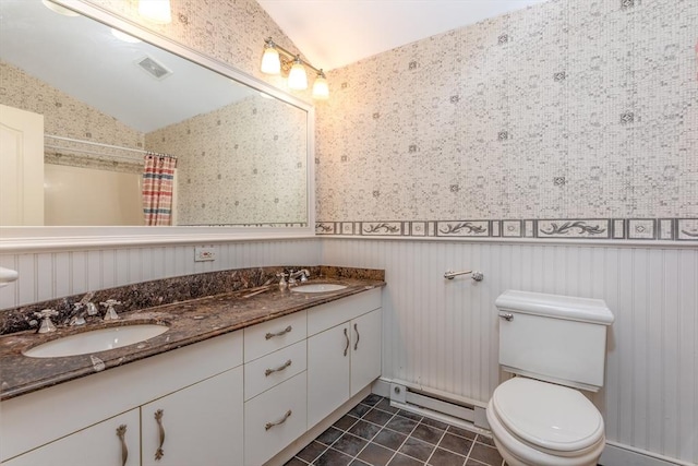 200 Falls Blvd Unit F305, Quincy, MA 02169 - full bathroom with baseboard heating, double vanity, vaulted ceiling, wainscoting, and tile patterned floors