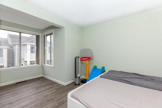 200 Falls Blvd Unit F305, Quincy, MA 02169 - bedroom with wood finished floors and baseboards