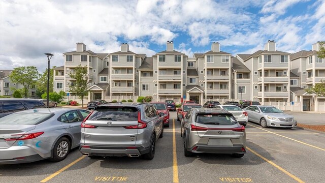 200 Falls Blvd Unit F305, Quincy, MA 02169 - view of building exterior with uncovered parking and a residential view