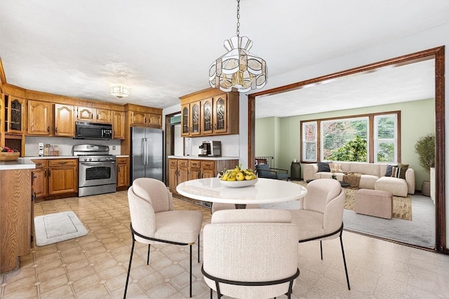 dining space with a chandelier and light floors