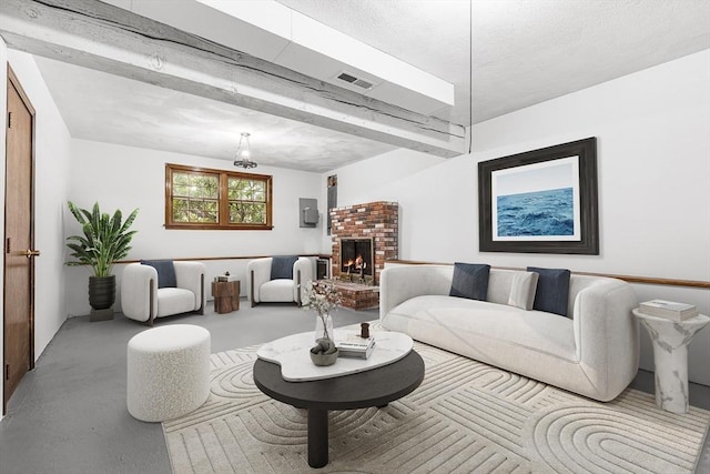 living area with visible vents and a fireplace
