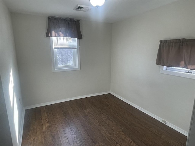 empty room featuring dark hardwood / wood-style floors