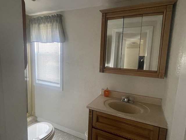 bathroom with vanity and toilet