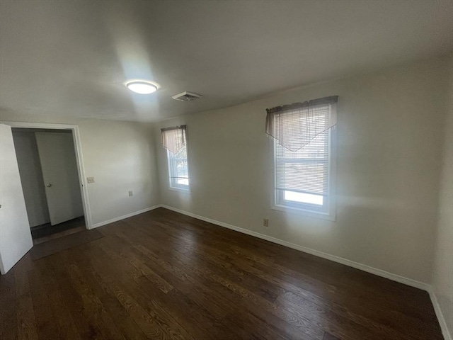 empty room featuring dark hardwood / wood-style floors