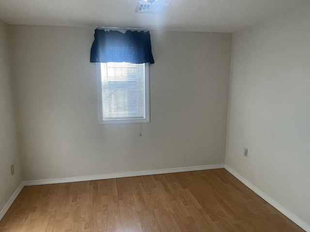 unfurnished room featuring light wood-type flooring