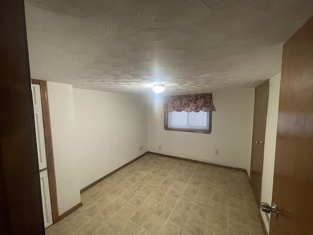 empty room with a textured ceiling