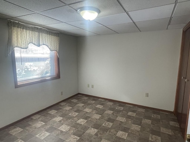 spare room with a paneled ceiling