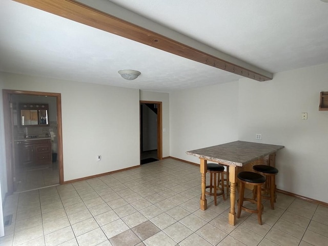 unfurnished dining area featuring light tile patterned flooring