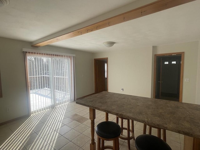 unfurnished dining area with light tile patterned floors