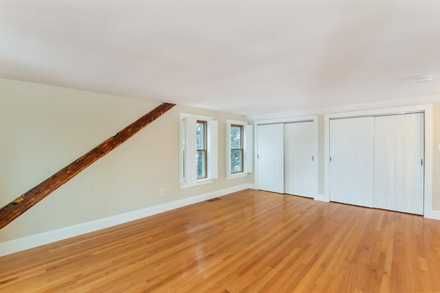 bonus room with light hardwood / wood-style floors