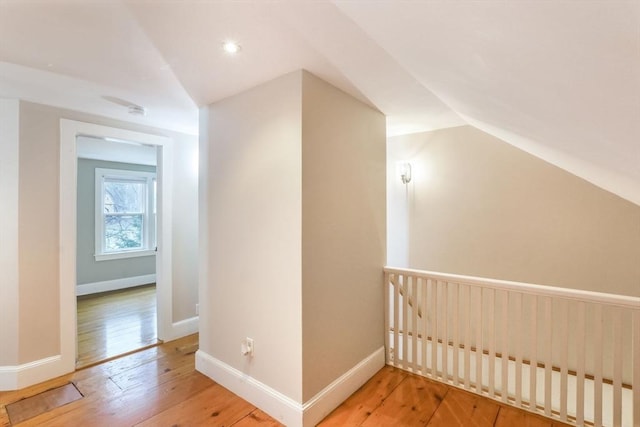 bonus room featuring hardwood / wood-style flooring and vaulted ceiling