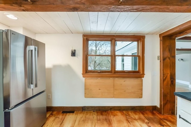 doorway featuring wood ceiling and hardwood / wood-style flooring