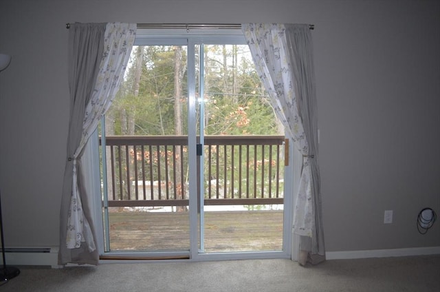 doorway with carpet floors, baseboards, and a baseboard radiator