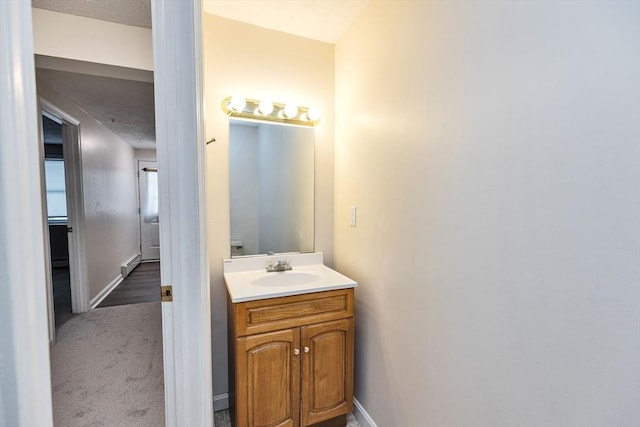 bathroom featuring vanity and baseboards