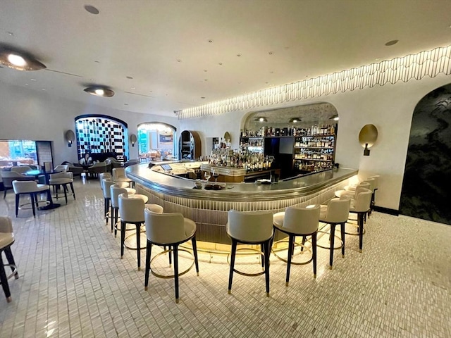bar with arched walkways and a community bar