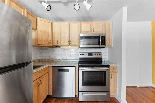 108 Oak Ln Unit 3, Brockton, MA 02301 - kitchen featuring appliances with stainless steel finishes, wood finished floors, light brown cabinetry, and light countertops