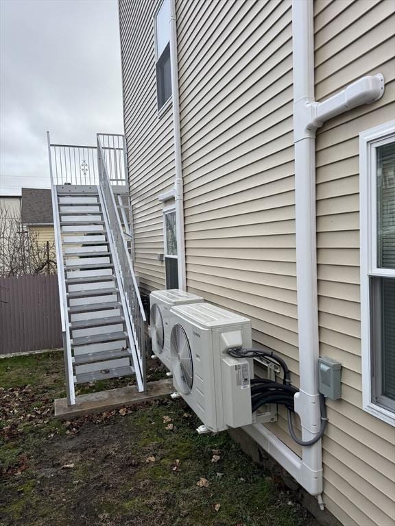 view of side of property with ac unit