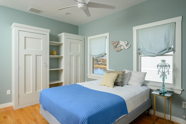 bedroom featuring light hardwood / wood-style floors and ceiling fan