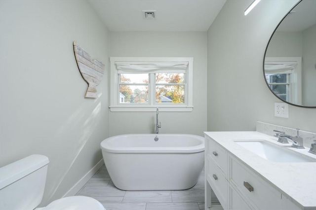 5 Oak Hill Rd, Wareham, MA 02571 - bathroom featuring a freestanding tub, vanity, toilet, baseboards, and marble look tile flooring