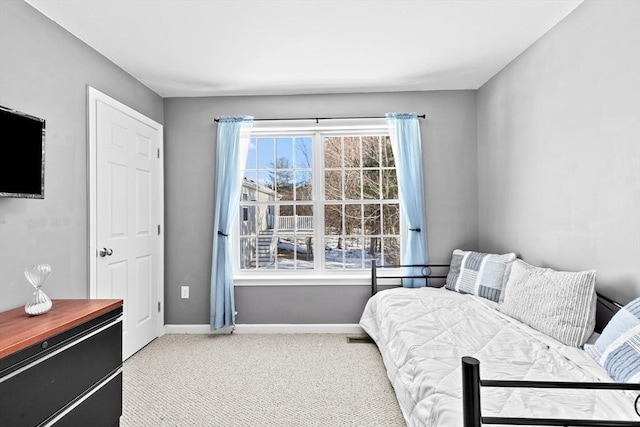 bedroom featuring light carpet