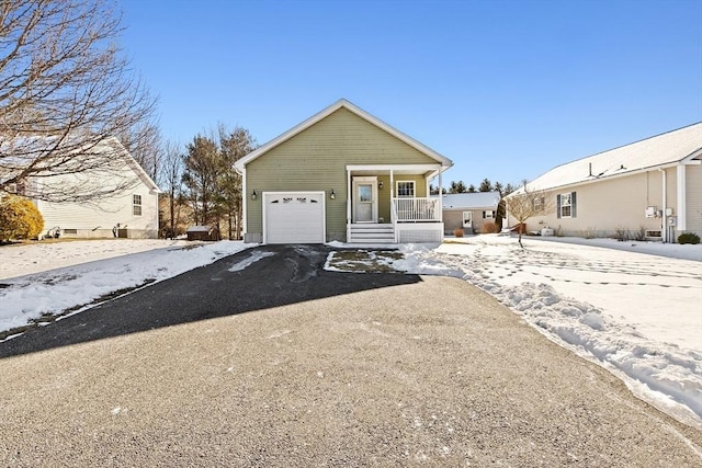 view of front of property featuring a garage and a porch