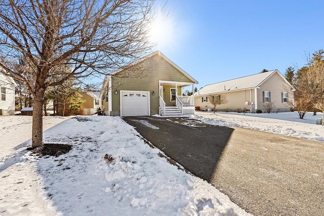 view of front of house featuring a garage and a porch