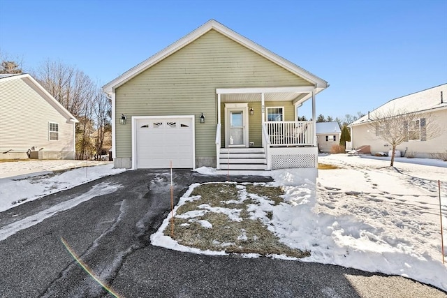 view of front facade with a garage and covered porch