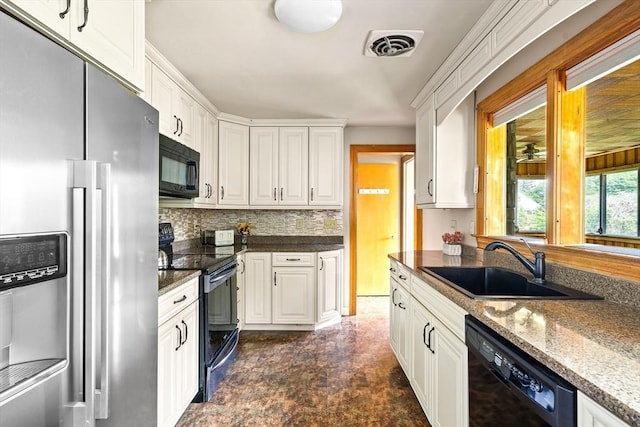 16 Sheldon Ave, Easthampton, MA 01027 - kitchen with black appliances, white cabinets, and decorative backsplash