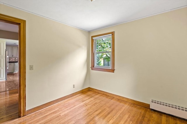16 Sheldon Ave, Easthampton, MA 01027 - spare room featuring a baseboard radiator, light wood-style floors, and crown molding