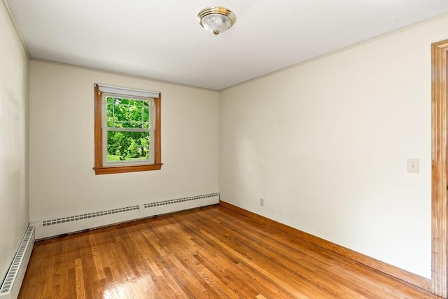 16 Sheldon Ave, Easthampton, MA 01027 - empty room with a baseboard radiator, wood finished floors, and ornamental molding