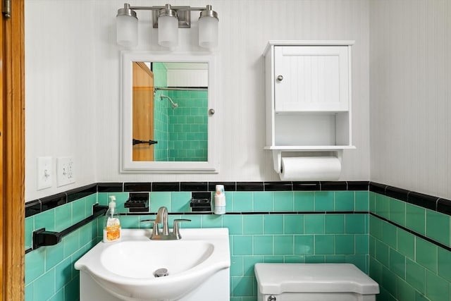 16 Sheldon Ave, Easthampton, MA 01027 - half bathroom featuring wainscoting and tile walls