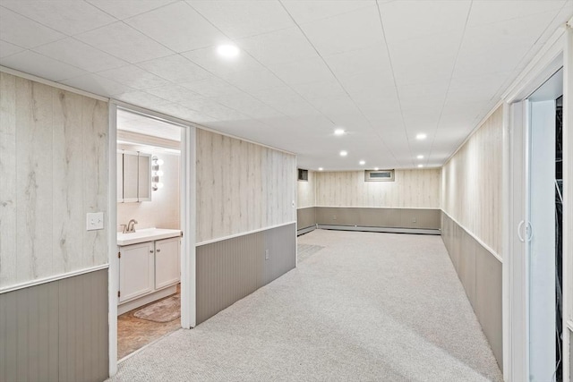 16 Sheldon Ave, Easthampton, MA 01027 - finished basement featuring carpet flooring, wood walls, recessed lighting, and a baseboard radiator