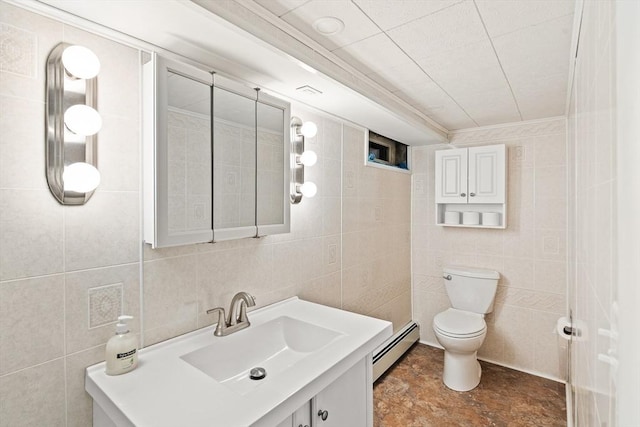 16 Sheldon Ave, Easthampton, MA 01027 - bathroom featuring a baseboard heating unit, tile walls, vanity, and ornamental molding
