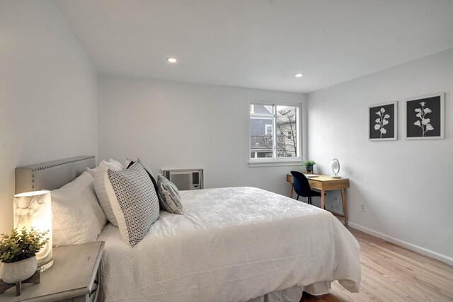 bedroom with baseboards, recessed lighting, and wood finished floors